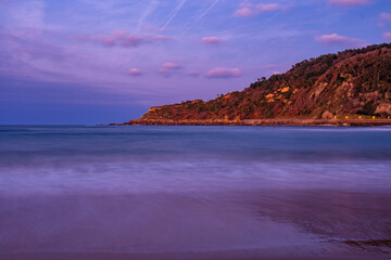Obraz premium The Zurriola beach of San Sebastian, Spain at Sunset