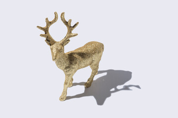 Christmas reindeer with strong shadows on white background. Creative Christmas or New Year concept.