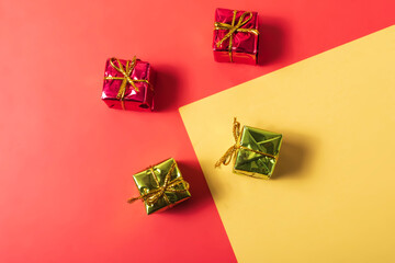 Christmas gift boxes on colorful background. Flat lay, top view.