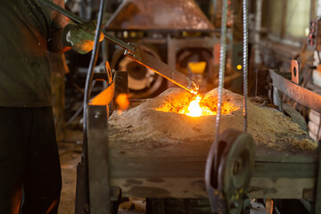Foundry - ferrous metal is melted in an induction furnace of metallurgical plant