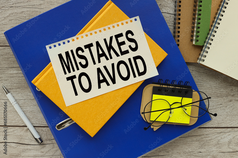 Poster mistakes to avoid text on the page. yellow notepad on blue folder