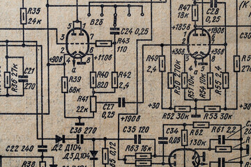 Old radio circuit printed on vintage paper electricity diagram as background. Electric radio scheme from USSR