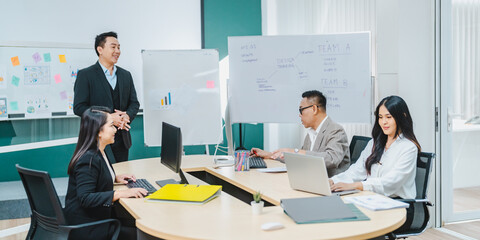 Businesspeople team partner meeting together to brainstorming for new ideas about business marketing project to partner working together planning success strategy enjoy teamwork in modern office