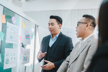 Group of multiethnic business people working and talking discussion in modern office, Businessman and businesswoman sitting around a conference table of business meeting seminar room