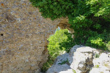 Ancient buildings cave fortress city Mangup-Kale, sunny day. Mountain view from the ancient cave town of Mangup-Kale in the Republic of Crimea, Russia. Bakhchisarai.