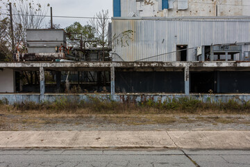 Side of abandoned ice making factory left to rot in the deep south