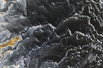 close up black and golden stone