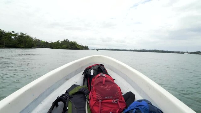 Backpacks in bow of speeding boat