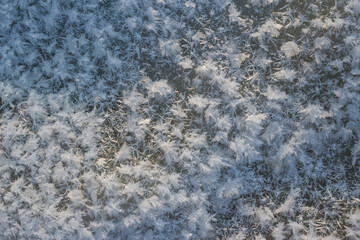 Large crystalline frost on river ice on a frosty day