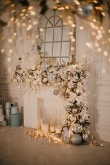 Fireplace decorated with New Year's decorations, toys and garlands. Modern New Year's decor for the living room and bedroom. Christmas tree, decorated with New Year's toys, stands near the fireplace