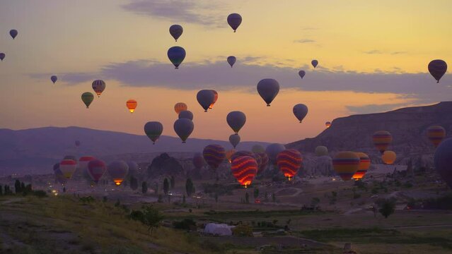 Captured against the canvas of the Cappadocian sky, this video showcases the enchanting spectacle of a hot air balloon festival. The vibrant balloons rise gracefully over the valleys of Cappadocia