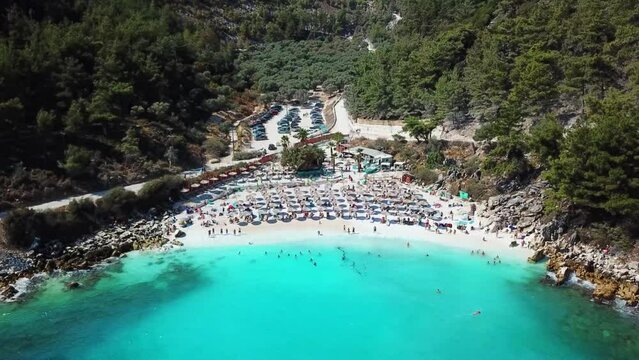 Marble Beach or Saliara Beach in Thassos Island , Greece , well known tourist attraction at Aegean Sea , famous for it's pure white marble sand ,aerial drone footage