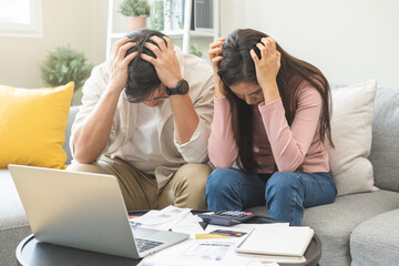 Stressed financial owe asian young couple love sitting suffer, stressed and confused by calculate expense from invoice or bill, no money to pay, mortgage or loan. Debt, bankrupt or bankruptcy people. - obrazy, fototapety, plakaty