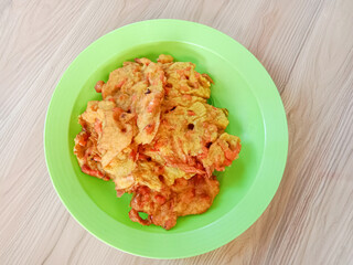 Bakwan, Bakwan udang or Shrimp fritters is a fritter made by deep frying battered shrimps in hot oil. Indonesian food.