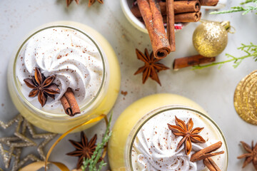Creamy Homemade Eggnog Pudding, Musse Dessert in glasses, with whipped cream and spices, sweet Christmas traditional taste dessert