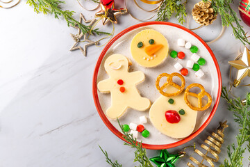 Christmas breakfast cheese sandwiches in form of xmas holiday festive symbols - gingerbread man,...
