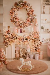 Modern New Year's decor for the living room and bedroom. Christmas tree, decorated with New Year's toys, stands near the fireplace