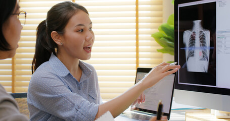Big data AI coding screen for asian future health care smart tech IT solution. Asia team woman...