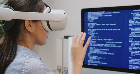 Metaverse app STEM platform developer future skill job workforce for asia people young woman work at home office wear VR headset typing test game on AI IT cyber security cloud computing web solution.