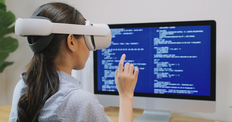 Metaverse app STEM platform developer future skill job workforce for asia people young woman work at home office wear VR headset typing test game on AI IT cyber security cloud computing web solution.