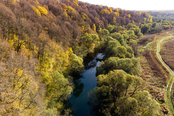 Aerial view of an autumn landscape with the flowing Nara River on the border of the Moscow region...