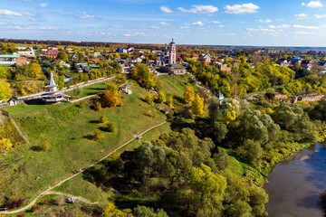 Picturesque tourist area with an Orthodox church in the village of Rusinovo, Borovsky district, Kaluga region, Russia. Panoramic aerial view