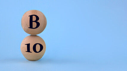 Vitamin B10 on wooden balls on a blue background