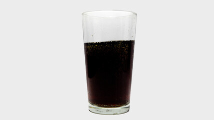 Soda in transparent glass isolated on a white background.