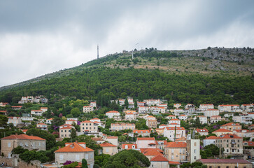 View to the red roofs of Dubrovnik Old town on cloudy summer day. 