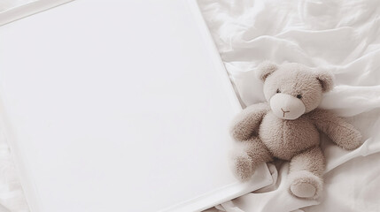 Teddy Bear Next to Empty White Book on Soft Bed Linens Neutral Tones Nursery Decor Ideas and Inspiration