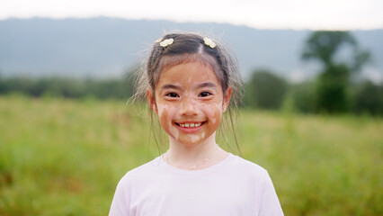 Little cute alpha young albino vitiligo small school girl relax smile look at camera. Real melanin face body skin care hair color of asia people gen z kid in self love happy proud of diverse beauty.