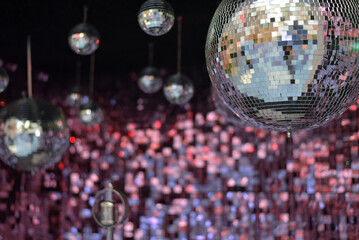 Mirror shiny ball on a pink background. Disco ball