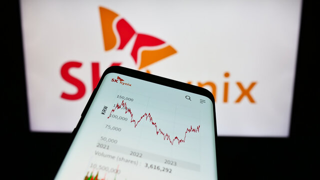 Stuttgart, Germany - 11-16-2023: Smartphone with website of South Korean semiconductor company SK hynix Inc. in front of business logo. Focus on top-left of phone display.