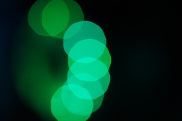 Green bokeh background  on black 