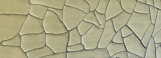 pattern of ancient style design decorative uneven cracked real stone wall surface with cement. Old...