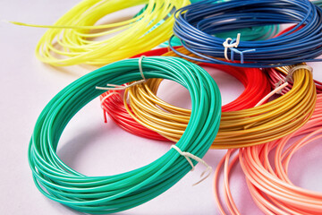 Closeup view of bunch of colorful plastic strings for modern 3D pen. Hobby, toys and craft...