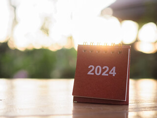 Close up 2024 desk calendar on the table with copy space. Resolution, Goal, Action, Planning, and manage to success business.