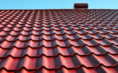 The roof of the house is covered with metal tiles
