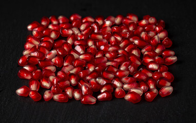 Ripe pomegranate seeds, bright and juicy fruits for a healthy diet