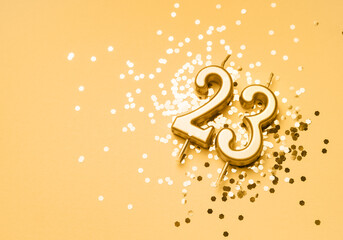 23 years birthday celebration festive background made with golden candle in the form of number...