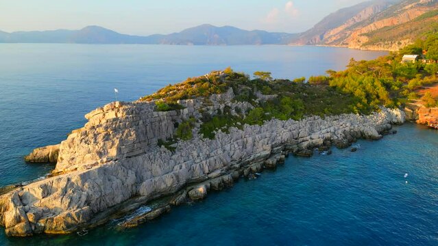 Aerial shot of rocky coastline in mediterranean sea.