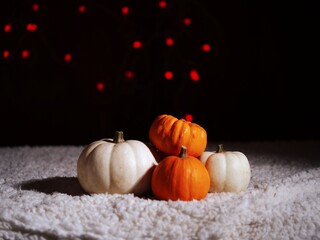 Autumn pumpkins with candles in warm background