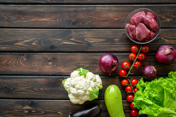 Keto diet food background. Raw beef meat and vegetables for cooking