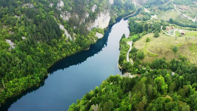 Drone footage of lake surrounded with woods and hills in Zaovine, Serbia