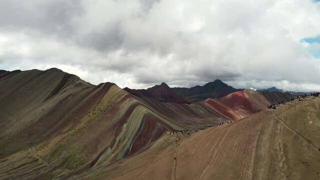 Drone view of Rainbow Mountain, officially Vinicunca, outsize Cuzco, Peru on a cloudy day