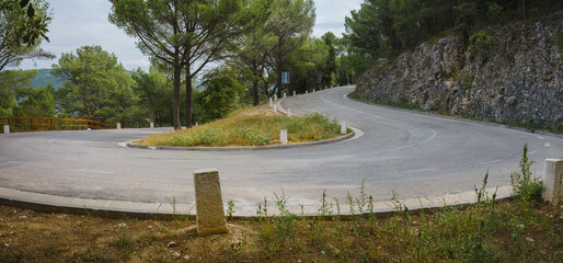 Hairpin turn on an empty mountain road in Croatia