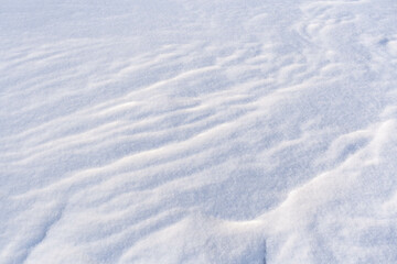 Fototapeta na wymiar Winter background with snowy ground. Natural snow texture.