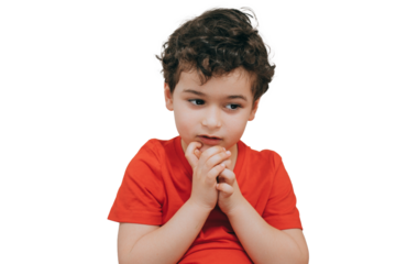 Little pensive curly boy makes decision being in doubts, has hesitation stands against transparent background with copy space.