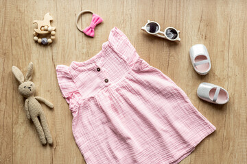 Fashion trendy look of baby girl with pink dress and accessories