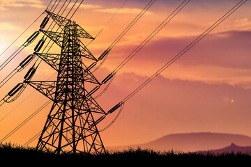 silhouette of the structure of high voltage transmission towers rural electric power distribution...